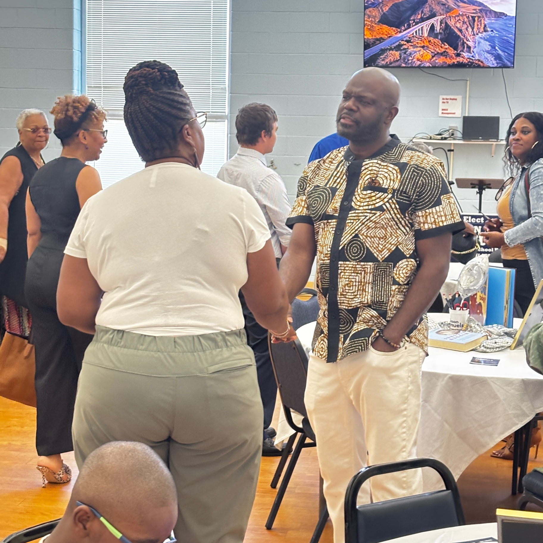 Jason Samuels greets a guest at the August 23 kickoff school supply drive.